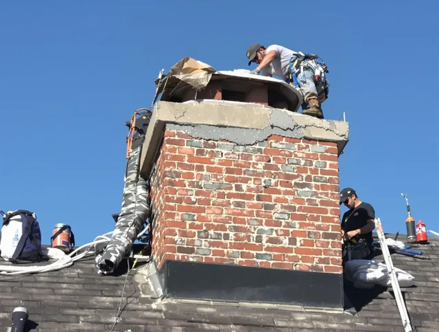 Twinsburg Chimney Sweep installing a custom chimney crown in Twinsburg, OH