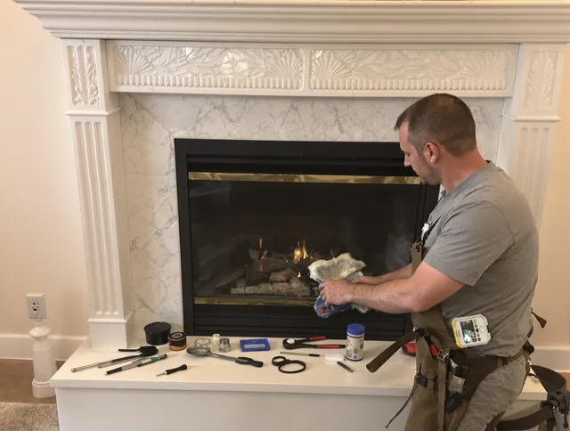Twinsburg Chimney Sweep performing fireplace maintenance in Twinsburg, OH